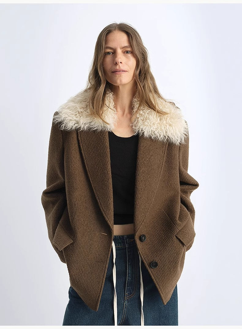 Woman wearing a brown coat with white fur collar on a white background
