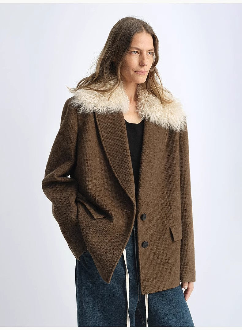 Woman wearing a brown coat with white fur trim on a white background