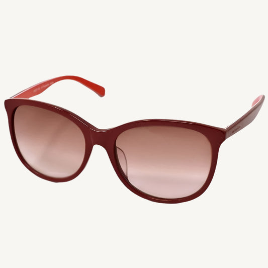 "Marimekko women's sunglasses in burgundy, model 33-0003-03, featuring a bold and modern design"