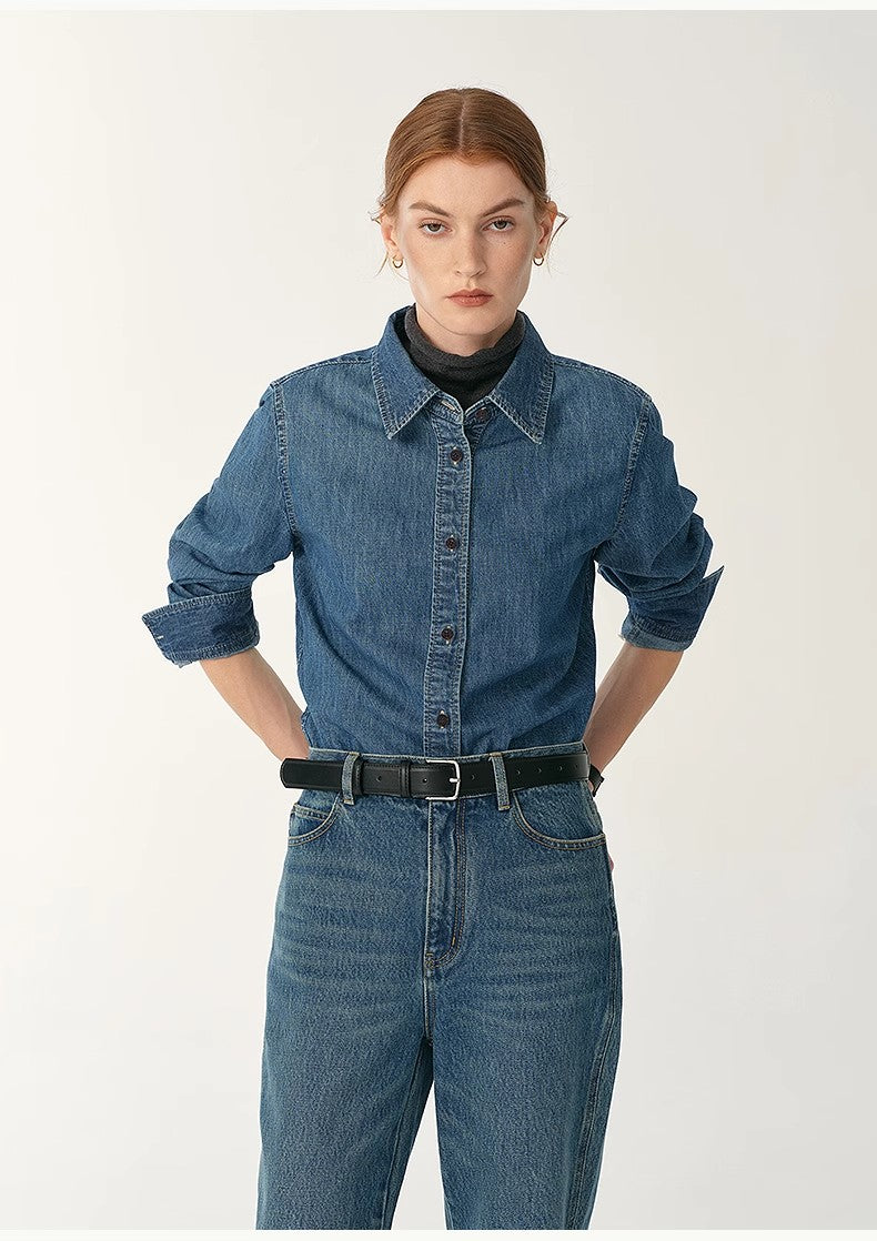 Person wearing a denim shirt and jeans on a white background