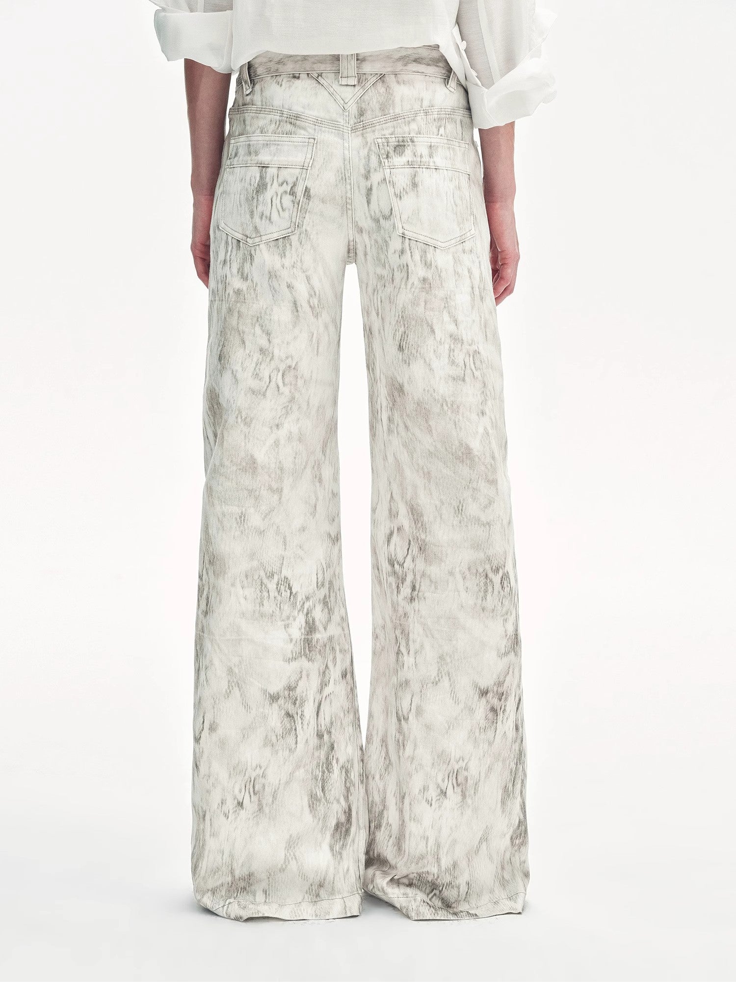 Floral-patterned wide-leg pants worn by a person on a white background