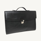 "Slim full-grain calfskin leather briefcase with lock and key closure, synthetic lining, and adjustable shoulder strap, designed for everyday business use."