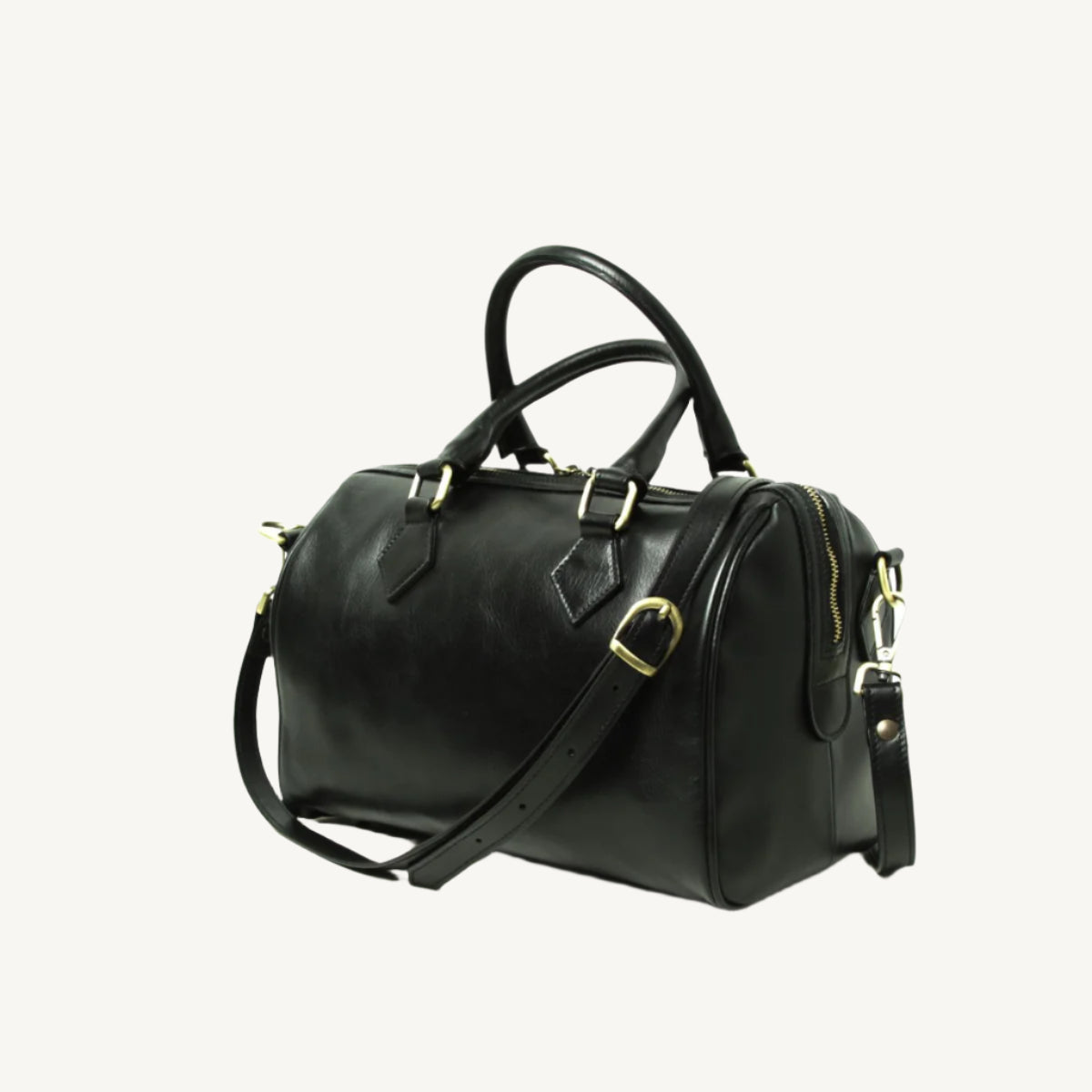Full grain leather shoulder bag with double handles, two inner zipped pockets, removable strap, and protective bottom feet, size 31x20x18 cm.