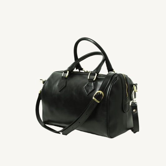Full grain leather shoulder bag with double handles, two inner zipped pockets, removable strap, and protective bottom feet, size 31x20x18 cm.