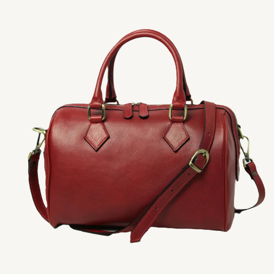 Elegant full-grain leather shoulder bag, 31x20x18 cm, with double handles, two interior zipped pockets, adjustable/removable strap, bottom feet, and polyester lining.