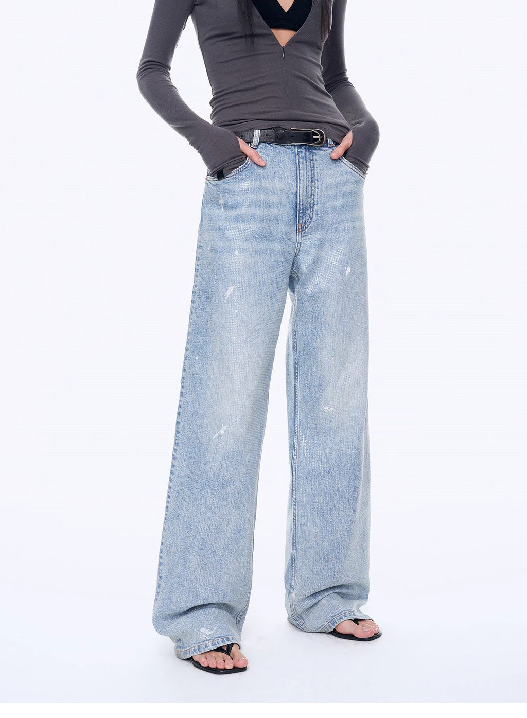 Light blue jeans worn by a person on a white background