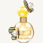 "Marc Jacobs Honey Eau de Parfum 3.3 oz – vibrant yellow bottle adorned with white polka dots and a playful butterfly-shaped cap, presented alongside its matching yellow polka dot box."