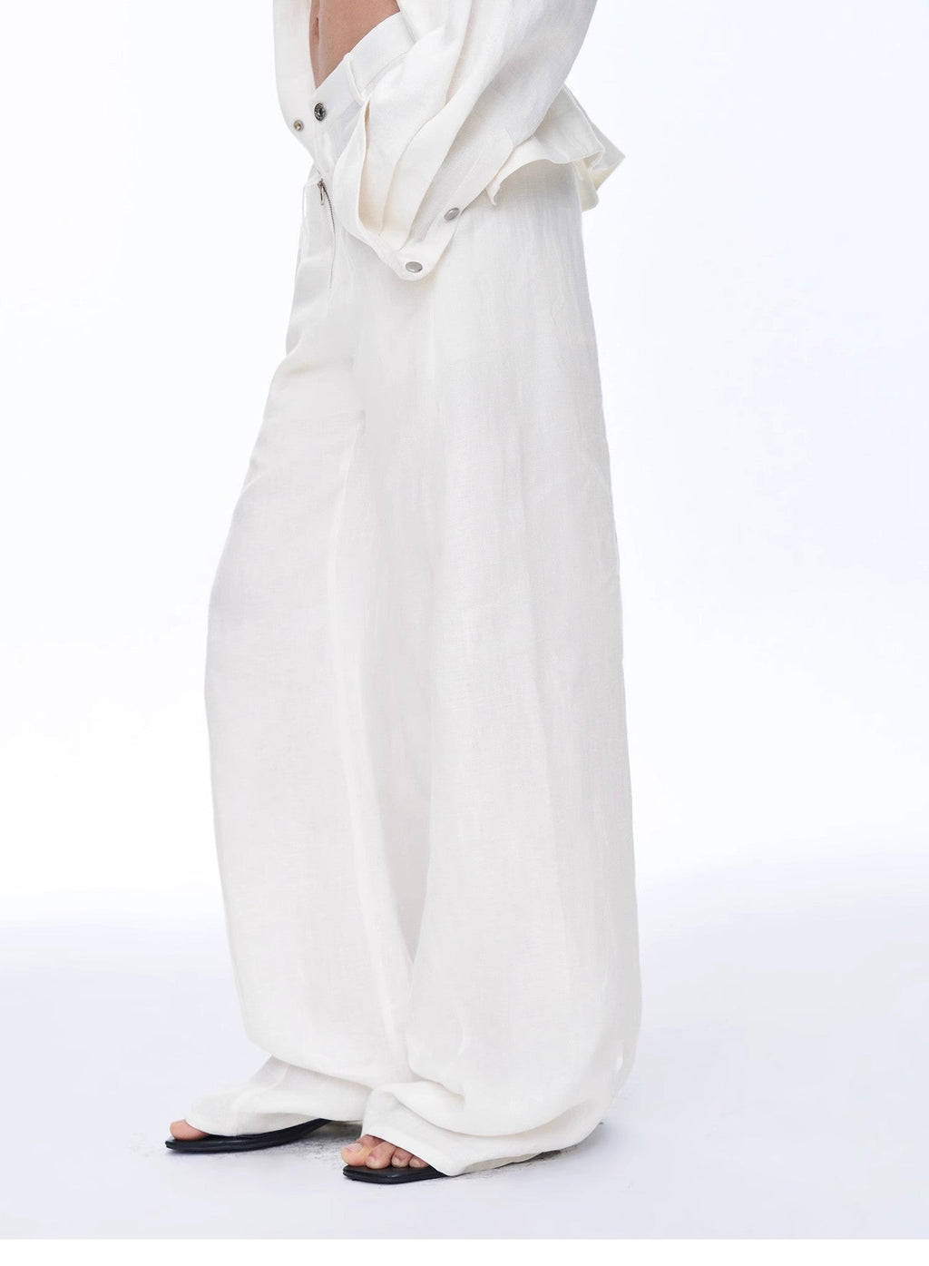 White outfit with a long skirt and top on a white background