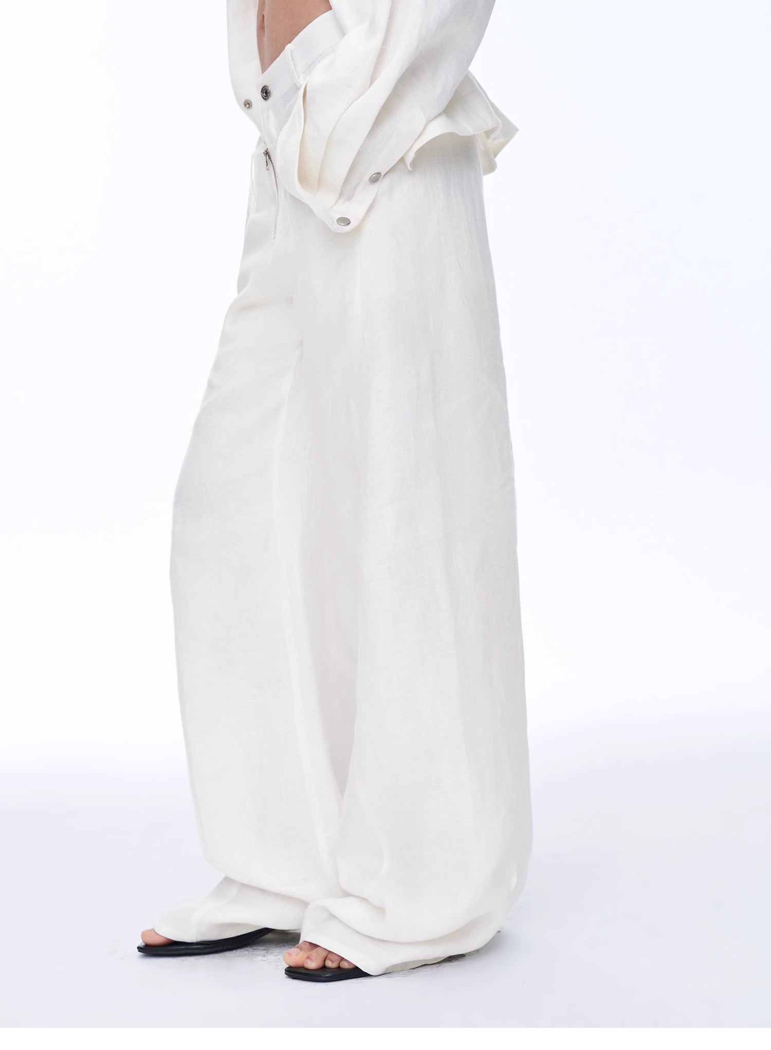 White outfit with a long skirt and top on a white background
