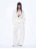 Person wearing a white outfit on a white background