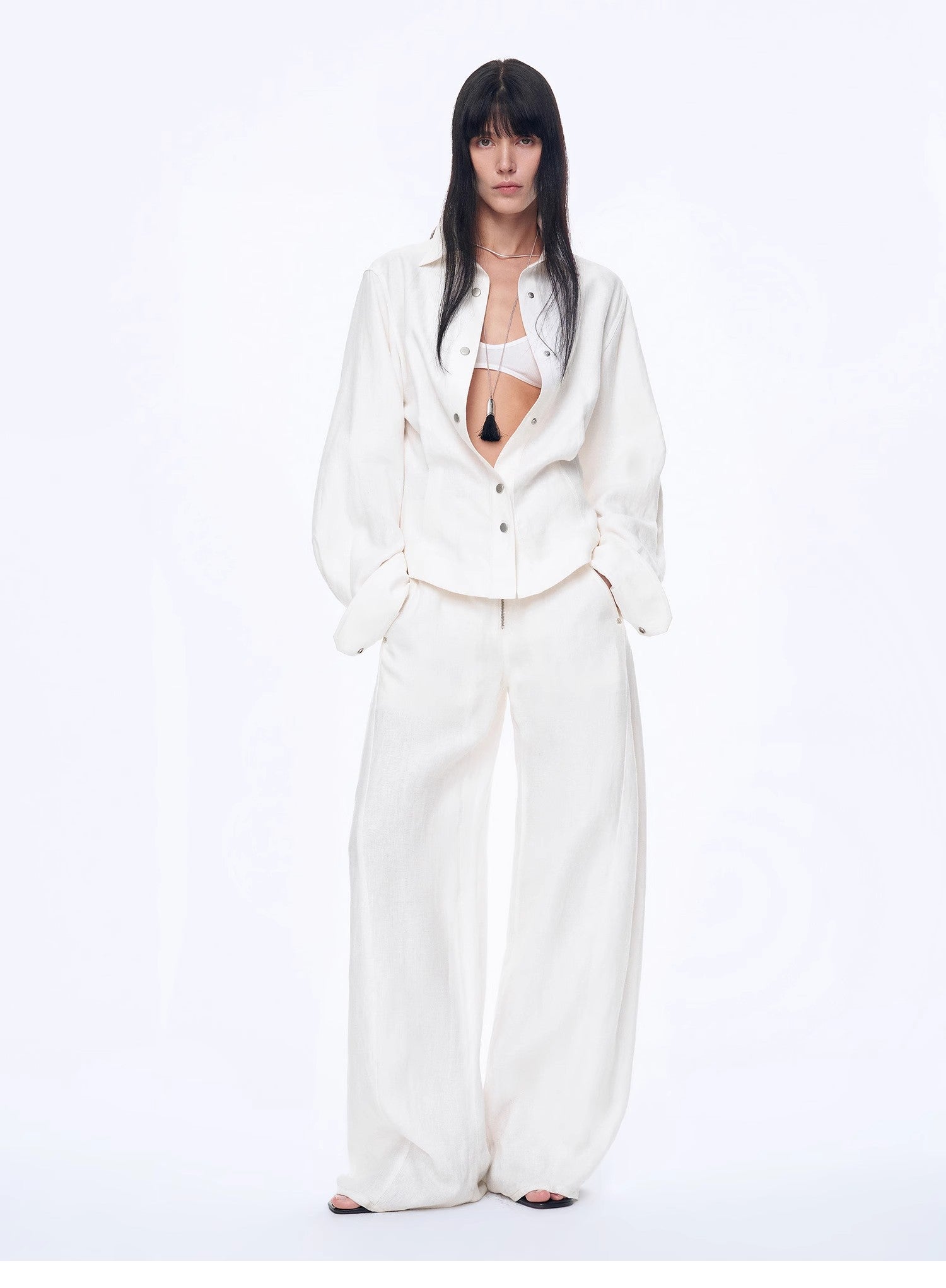 Person wearing a white outfit on a white background