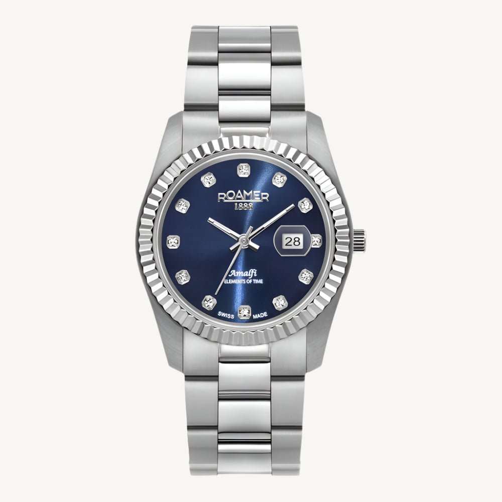 Elegant Roamer Amalfi ladies watch with silver stainless steel strap and blue stone-set dial, Swiss made.