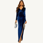 Woman wearing the Dariana Velvet Fringe High Split Dress, featuring rich velvet, a dramatic thigh-high split, and vintage-inspired fringe — perfect for red carpet and glamorous events.