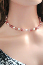 Necklace with pink and white beads on a model
