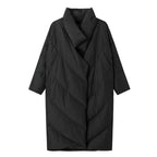 Black quilted coat on a white background