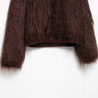 Brown textured sweater on a white background
