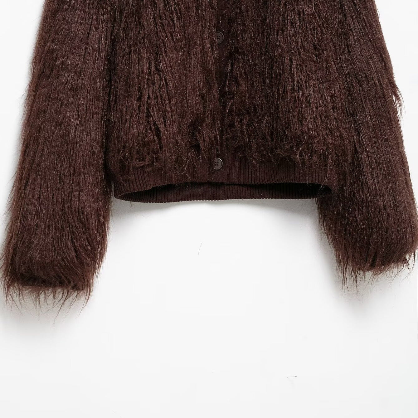 Brown textured sweater on a white background