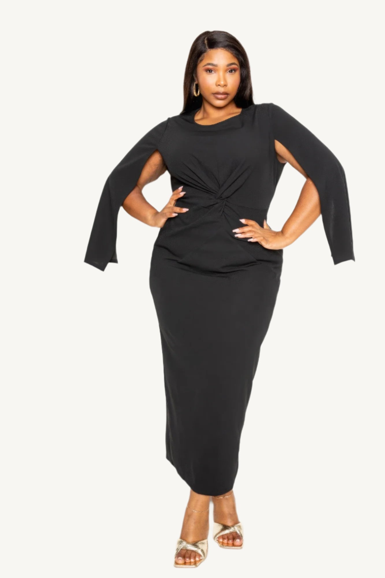 "Timeless black cape sleeve dress with front knot detail, tailored for elegance and comfort — perfect for formal or special occasions."