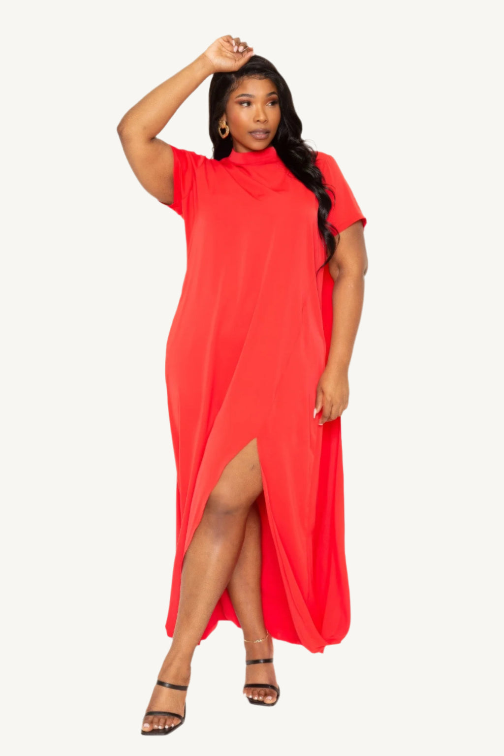 "Mock neck midi dress with dramatic back cape, tailored silhouette, and sleek modern design — a statement piece blending elegance and comfort."