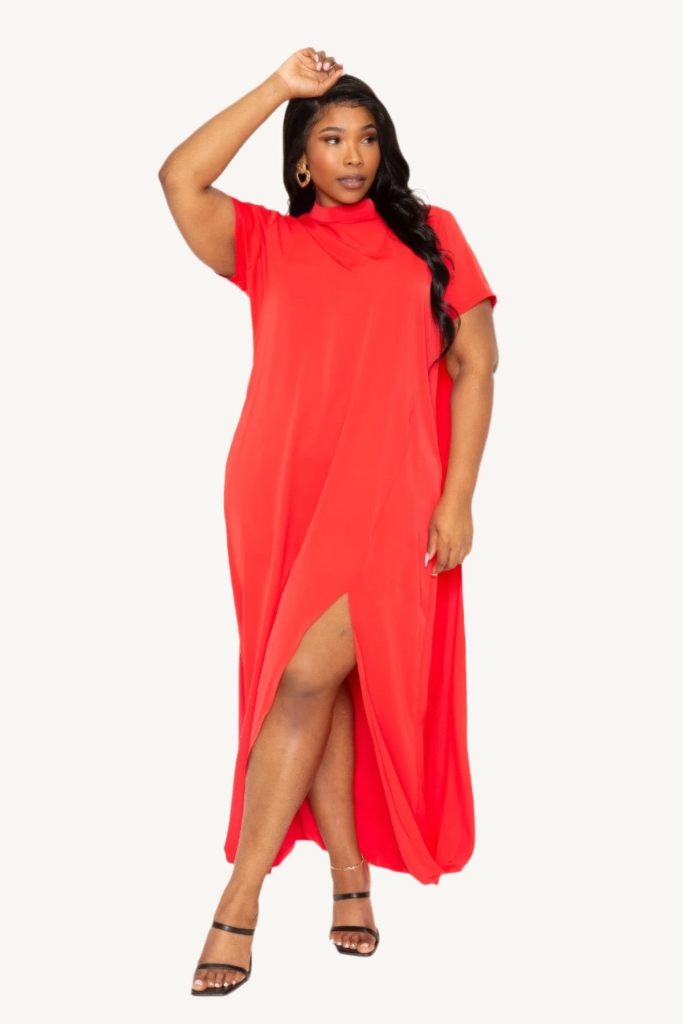 "Mock neck midi dress with dramatic back cape, tailored silhouette, and sleek modern design — a statement piece blending elegance and comfort."
