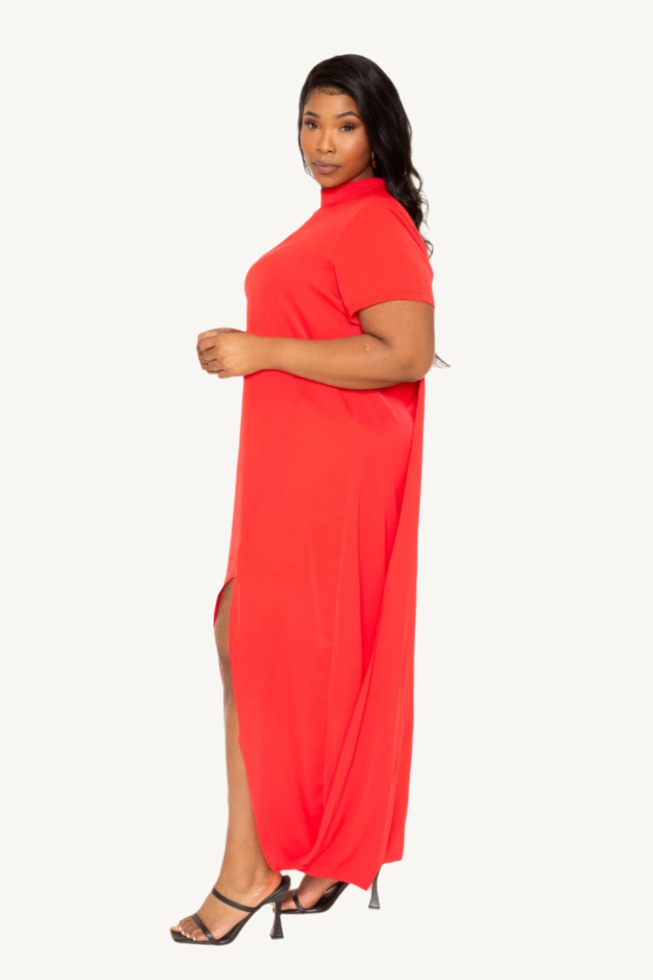 "Mock neck midi dress with dramatic back cape, tailored silhouette, and sleek modern design — a statement piece blending elegance and comfort."