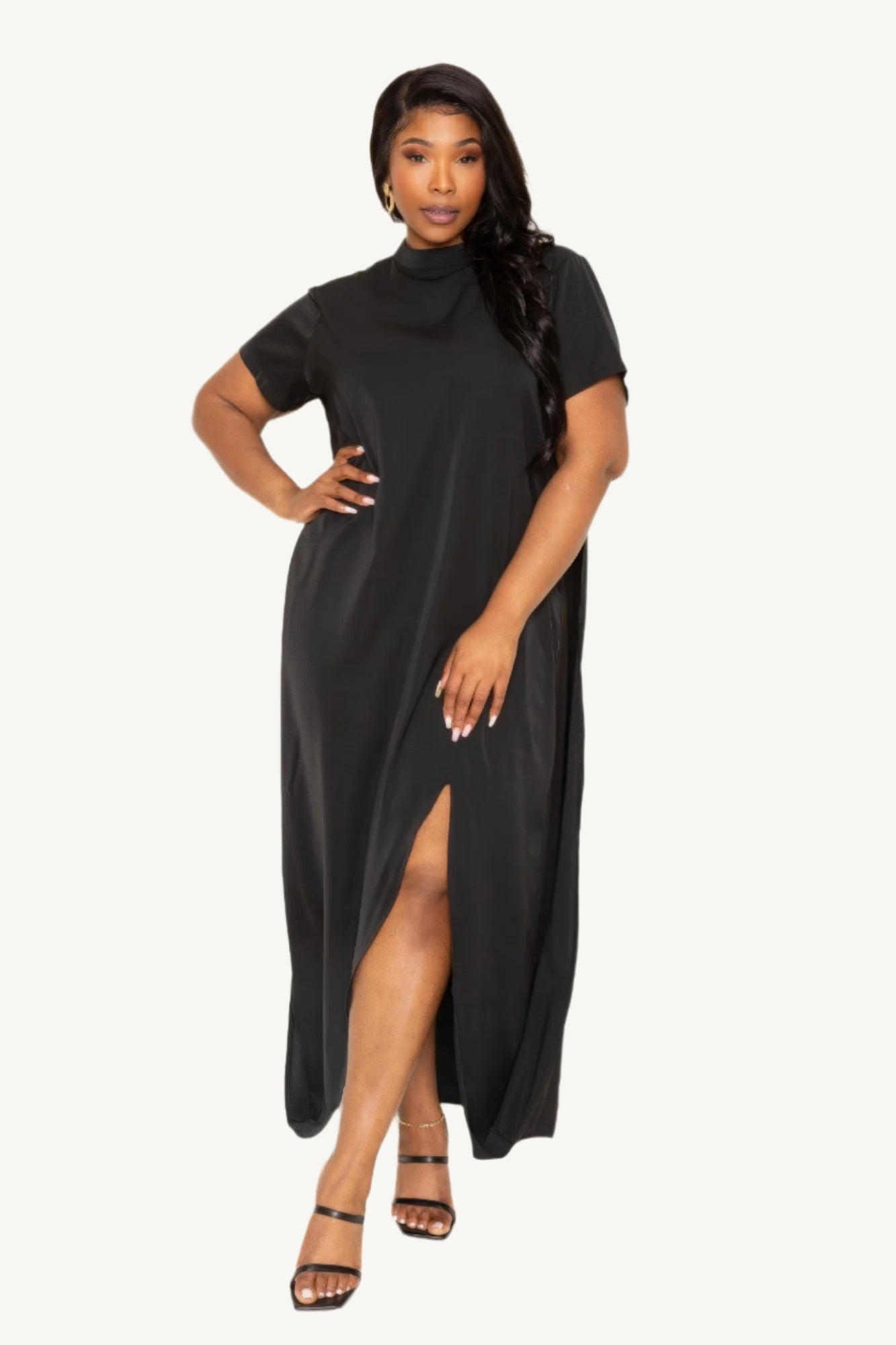 "Elegant mock neck dress with dramatic back cape detail, combining modern sophistication with timeless style for a standout, comfortable fit."
