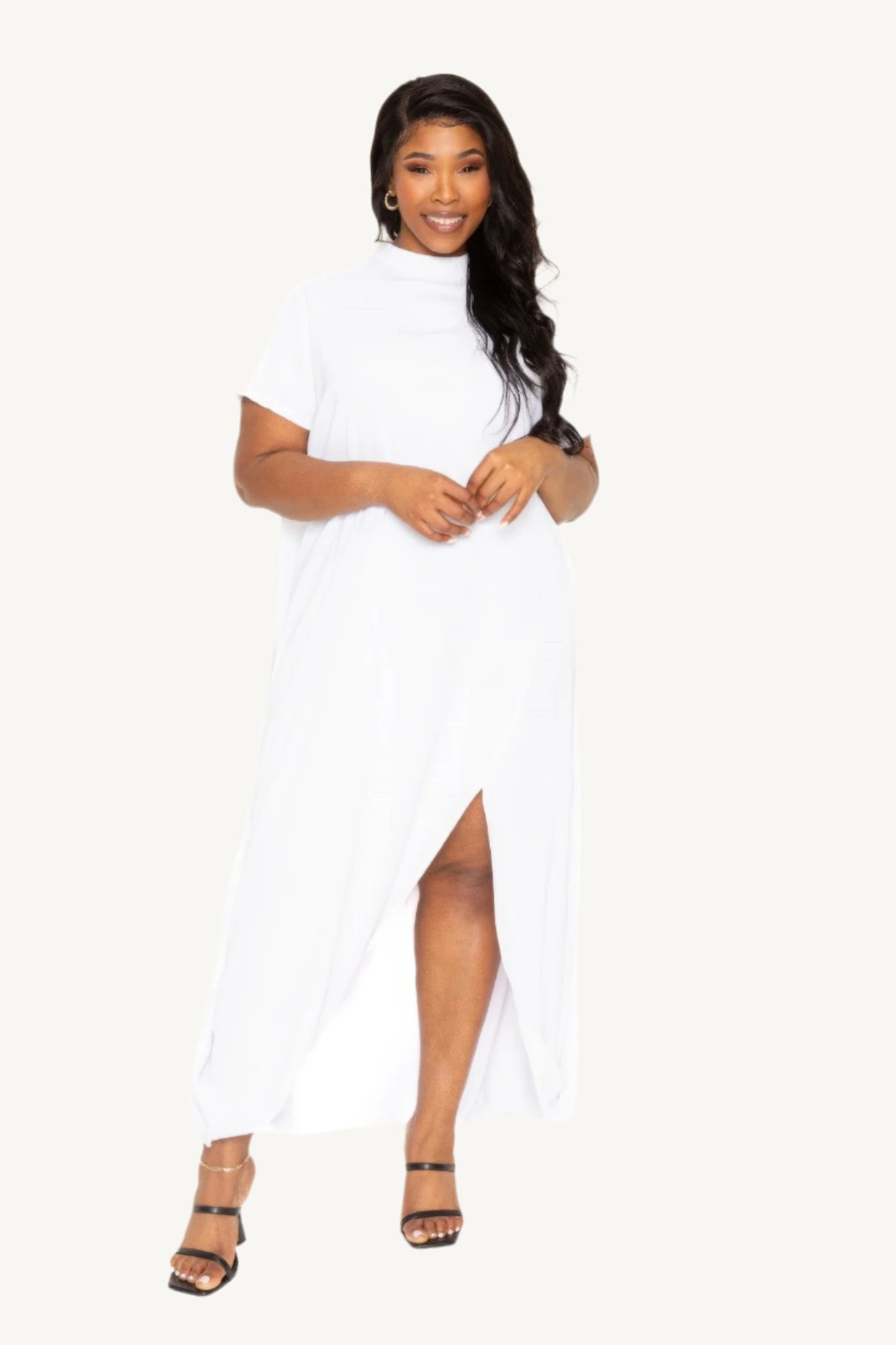 "Mock neck dress with dramatic back cape, combining sleek modern style with timeless sophistication — perfect for formal or special occasions."