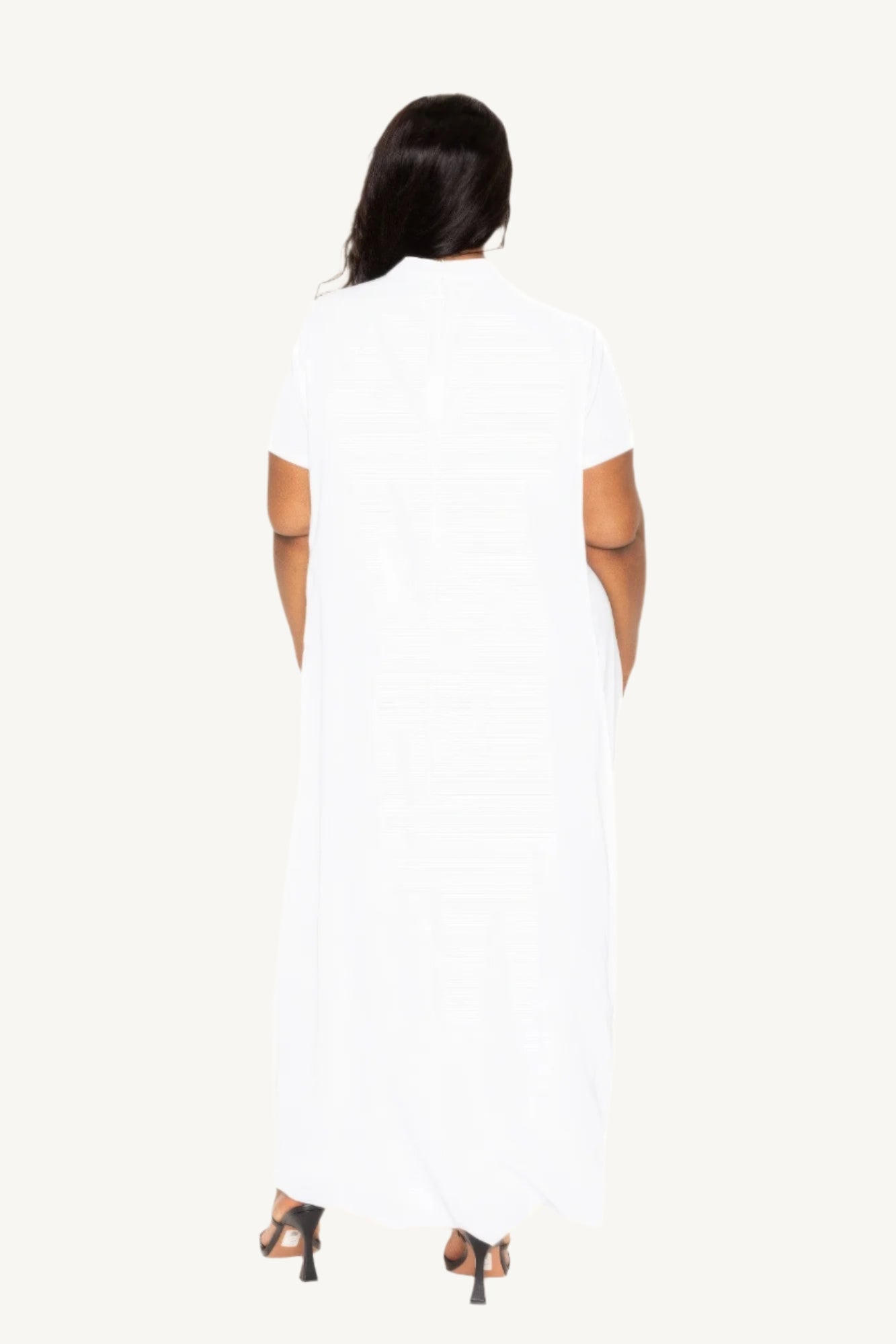 "Mock neck dress with dramatic back cape, combining sleek modern style with timeless sophistication — perfect for formal or special occasions."
