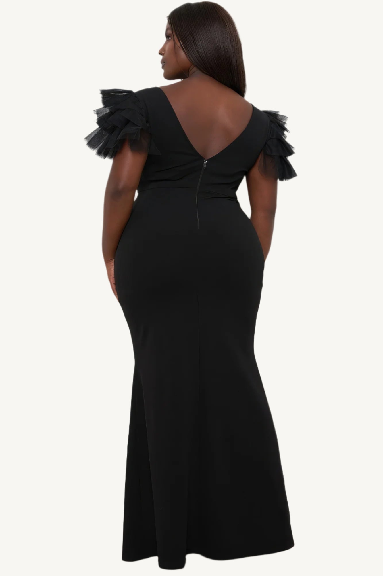 "Plus size maxi dress with mesh tulle shoulders, surplice neckline, pleated details, side slit, and zipper back — designed to enhance curves with elegance."