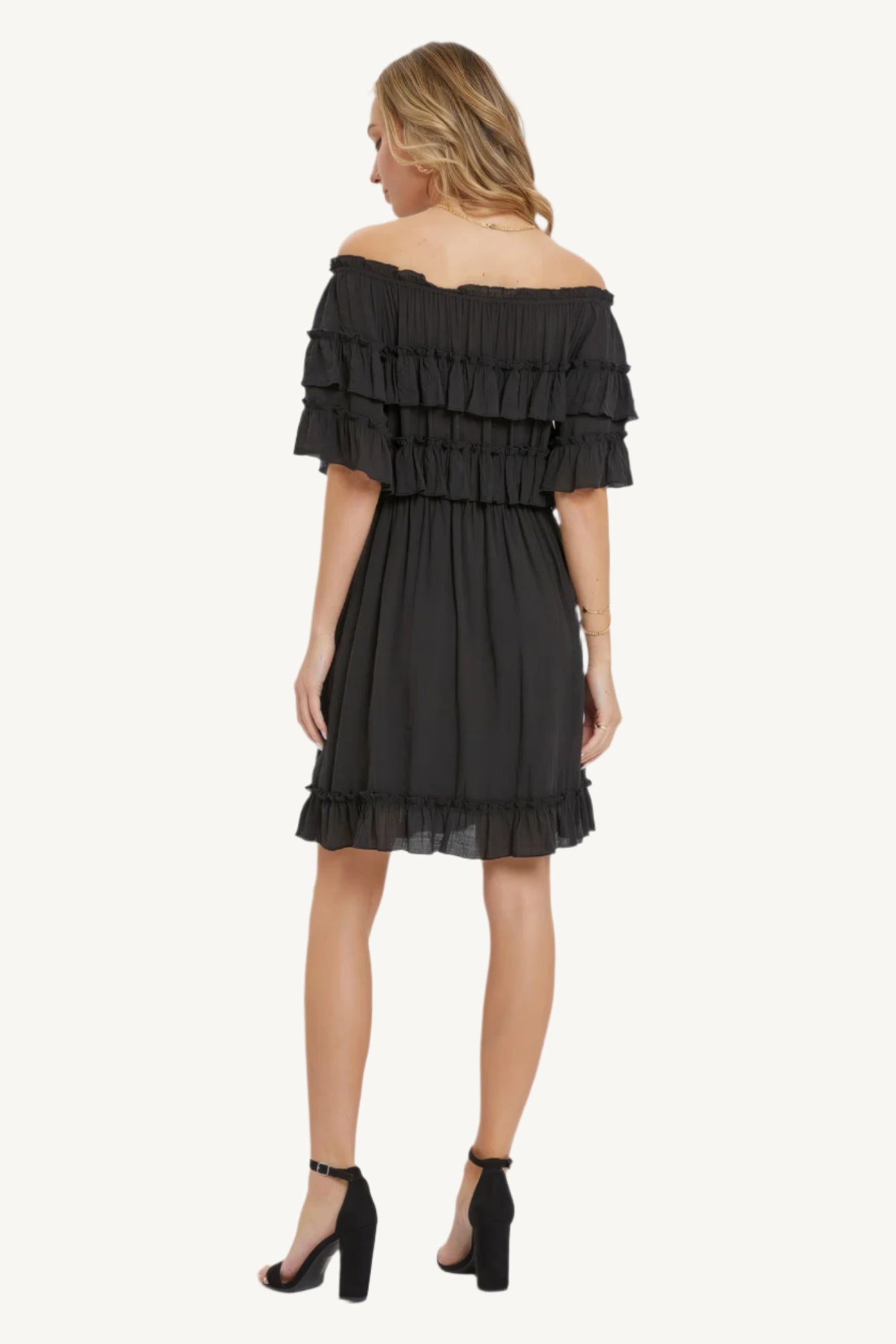 "Bohemian-style off-shoulder dress with short sleeves, elastic waist, and ruffle hem — relaxed fit for a free-spirited, feminine look."