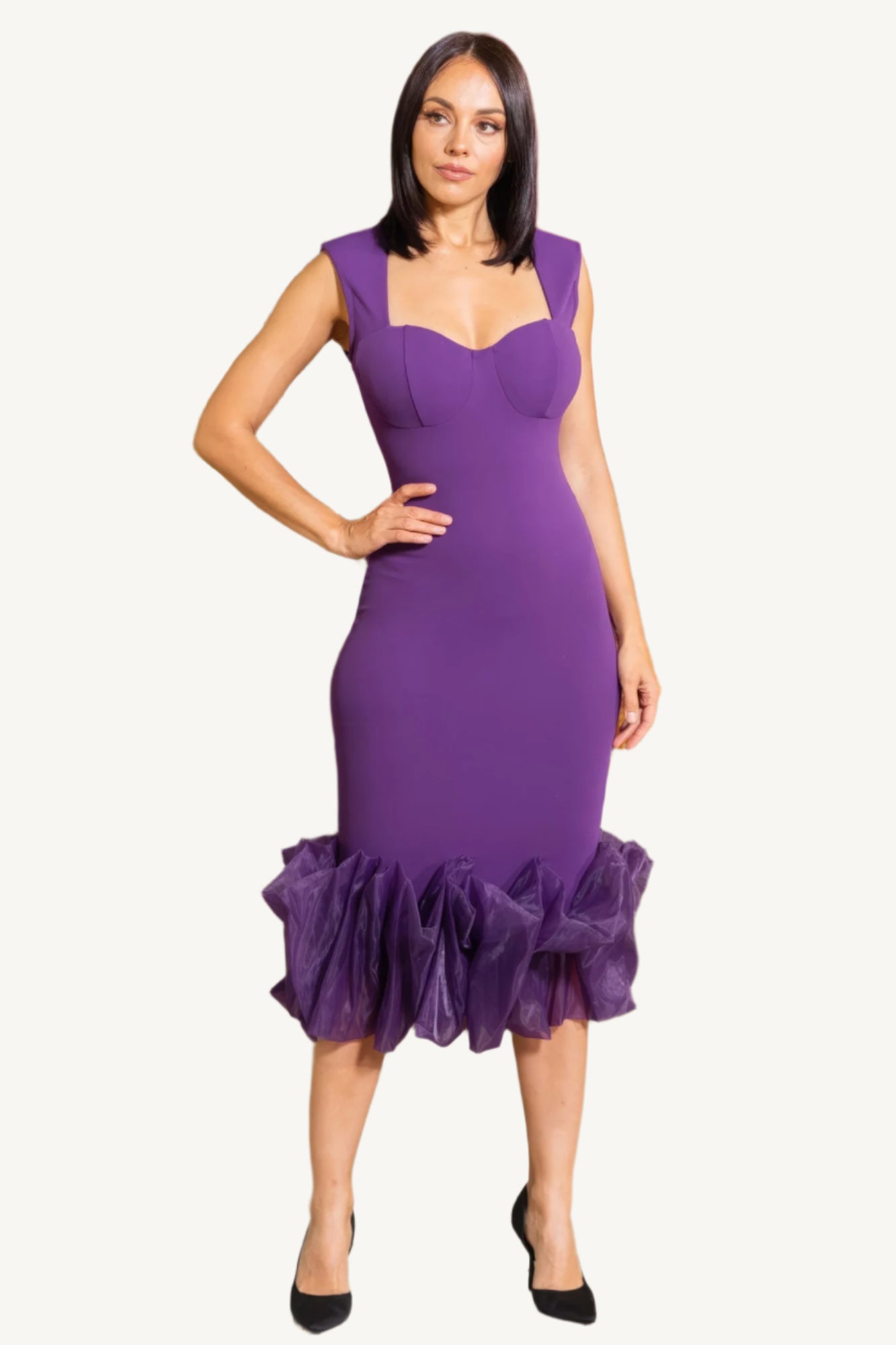"Elegant midi dress with organza ruffle detailing, sleeveless design, and back zipper closure for a chic and graceful silhouette."