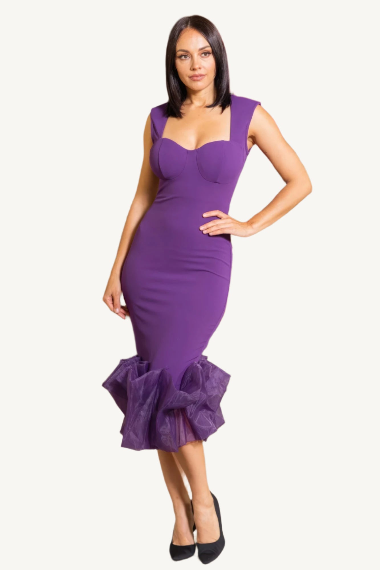 "Elegant midi dress with organza ruffle detailing, sleeveless design, and back zipper closure for a chic and graceful silhouette."