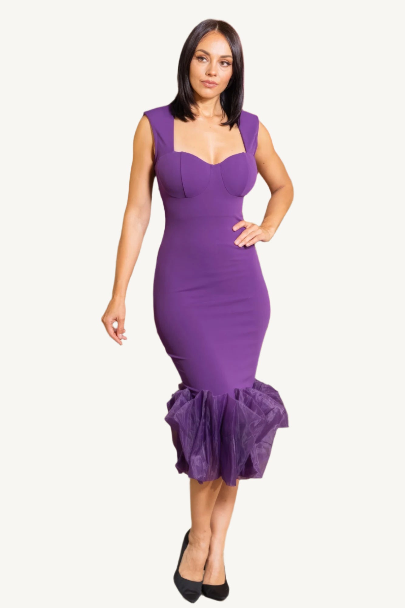 "Elegant midi dress with organza ruffle detailing, sleeveless design, and back zipper closure for a chic and graceful silhouette."