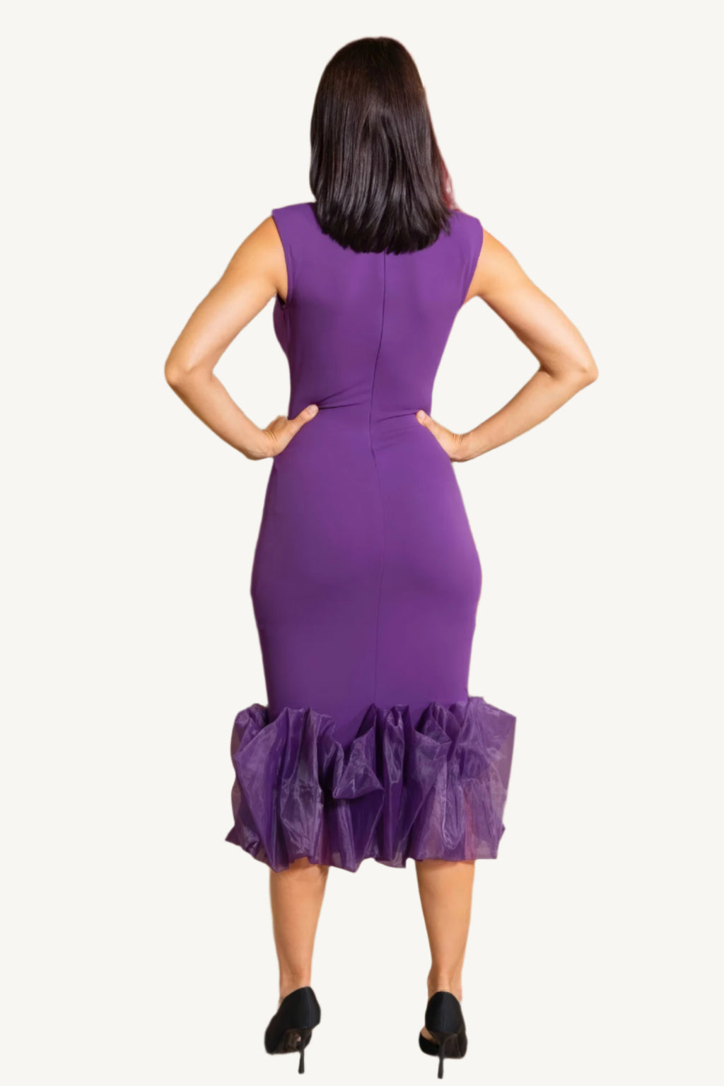 "Elegant midi dress with organza ruffle detailing, sleeveless design, and back zipper closure for a chic and graceful silhouette."