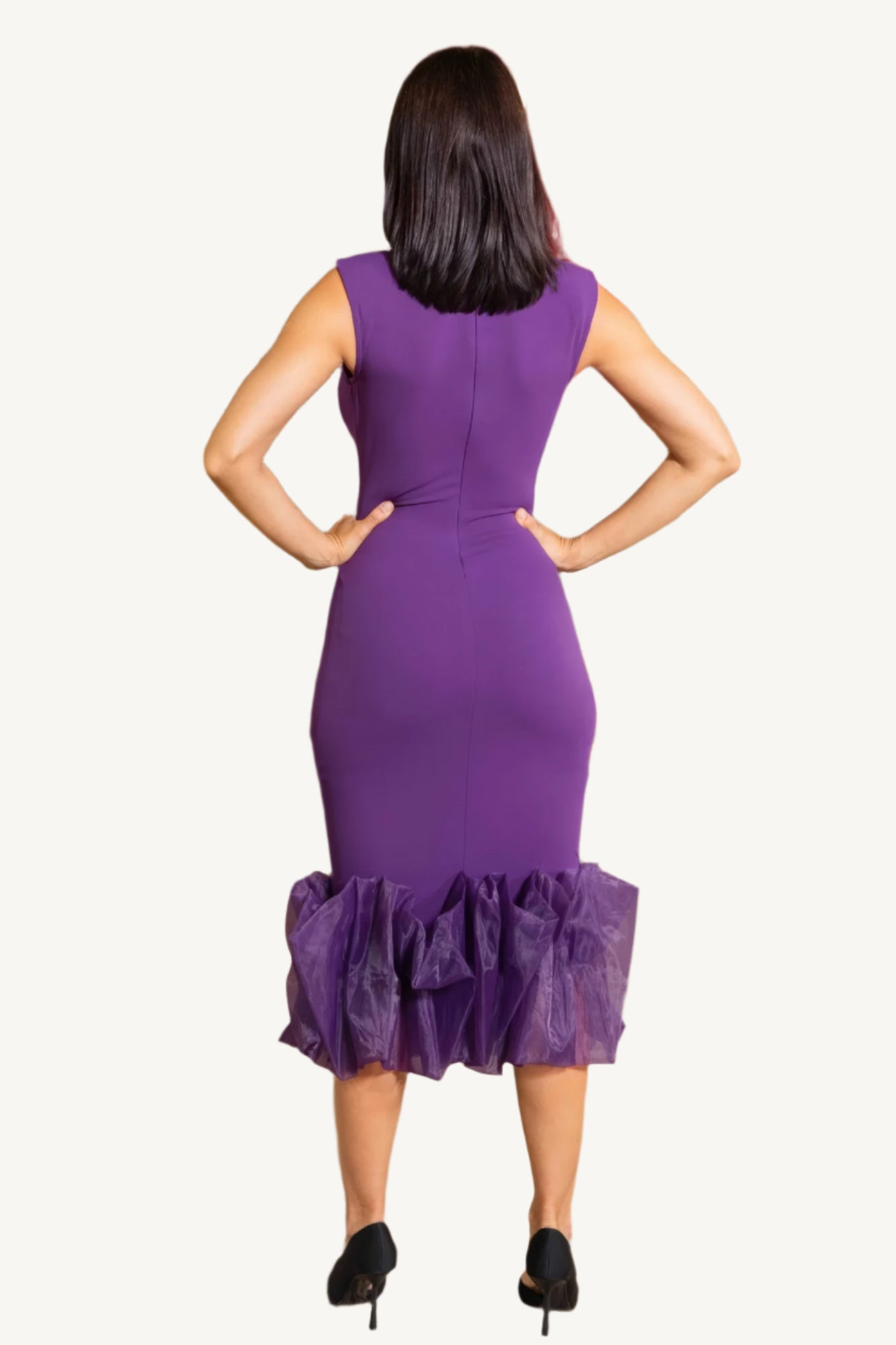 "Elegant midi dress with organza ruffle detailing, sleeveless design, and back zipper closure for a chic and graceful silhouette."