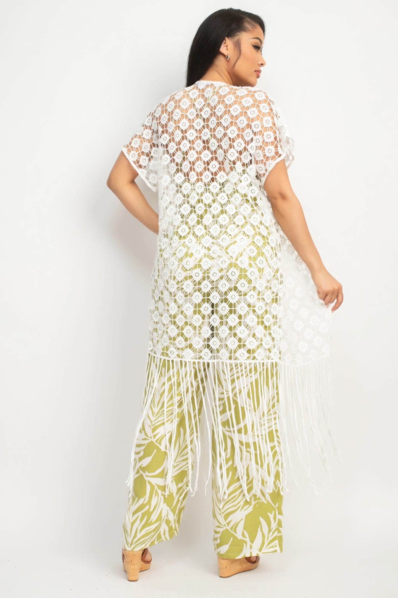 Woman wearing a floral dress with a white background