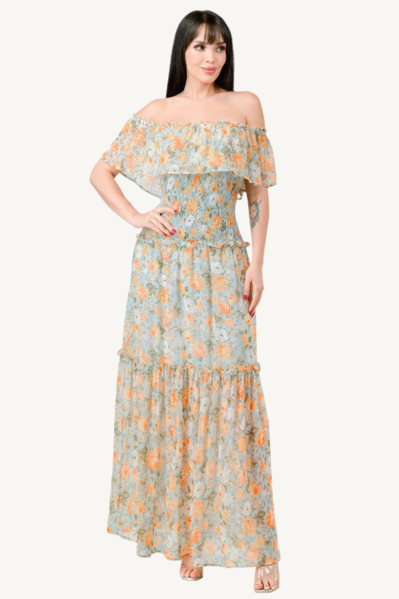"Floral chiffon off-shoulder tiered maxi dress with smocked back and ruffle details, made from lightweight 100% polyester for an elegant, flowy look."