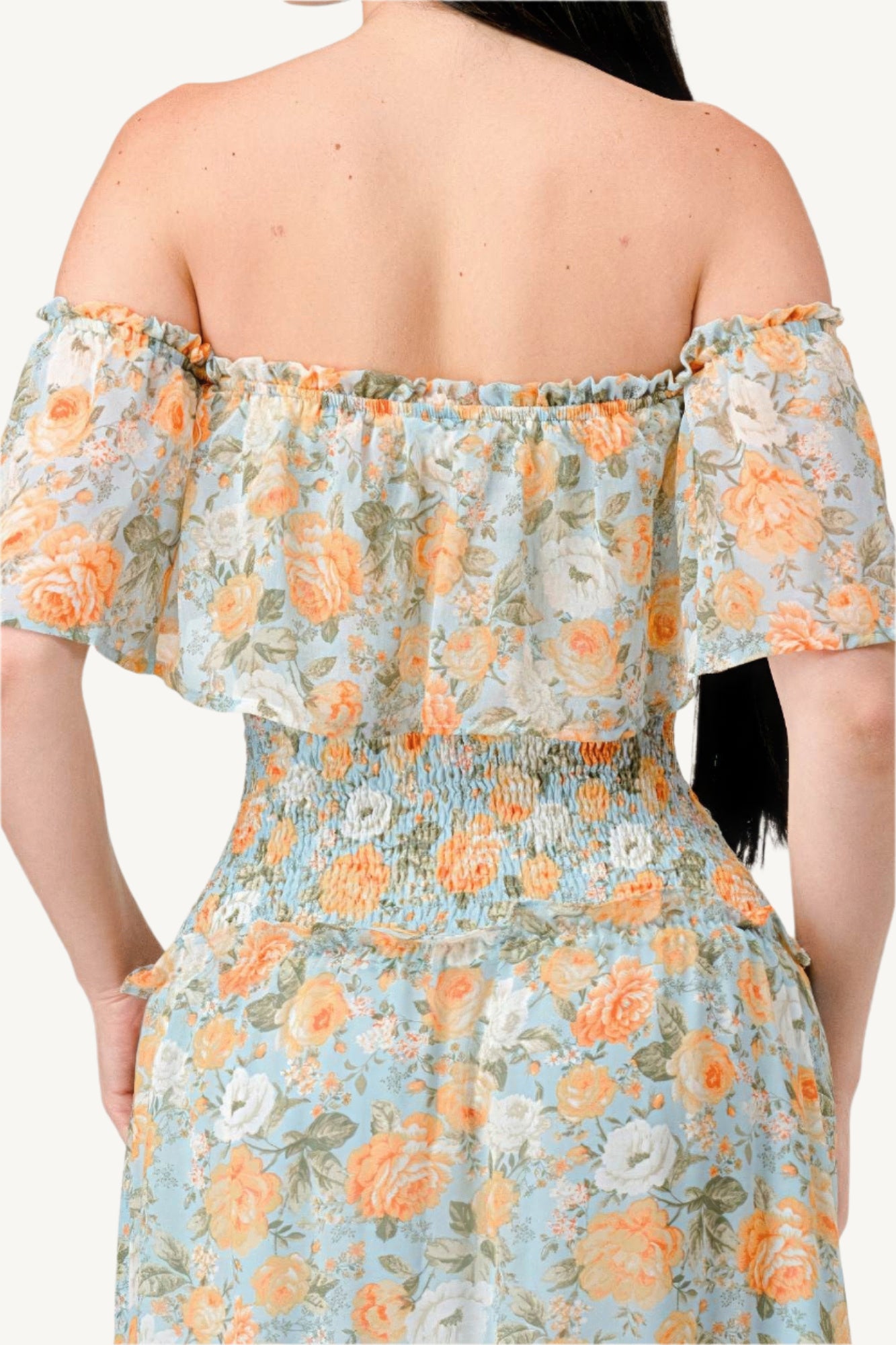 "Floral chiffon off-shoulder tiered maxi dress with smocked back and ruffle details, made from lightweight 100% polyester for an elegant, flowy look."