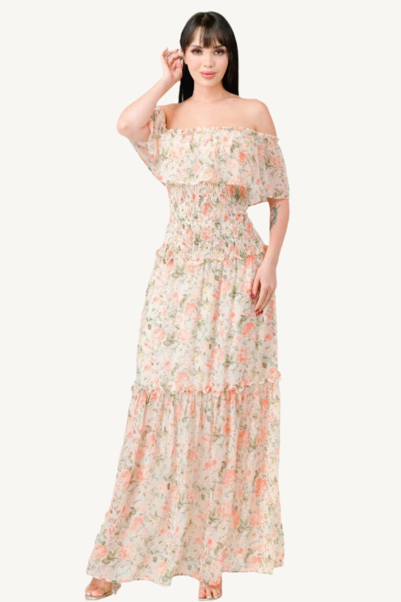 "Floral chiffon off-shoulder maxi dress with smocked back and ruffled tiered design, made from lightweight polyester for an elegant and comfortable look."