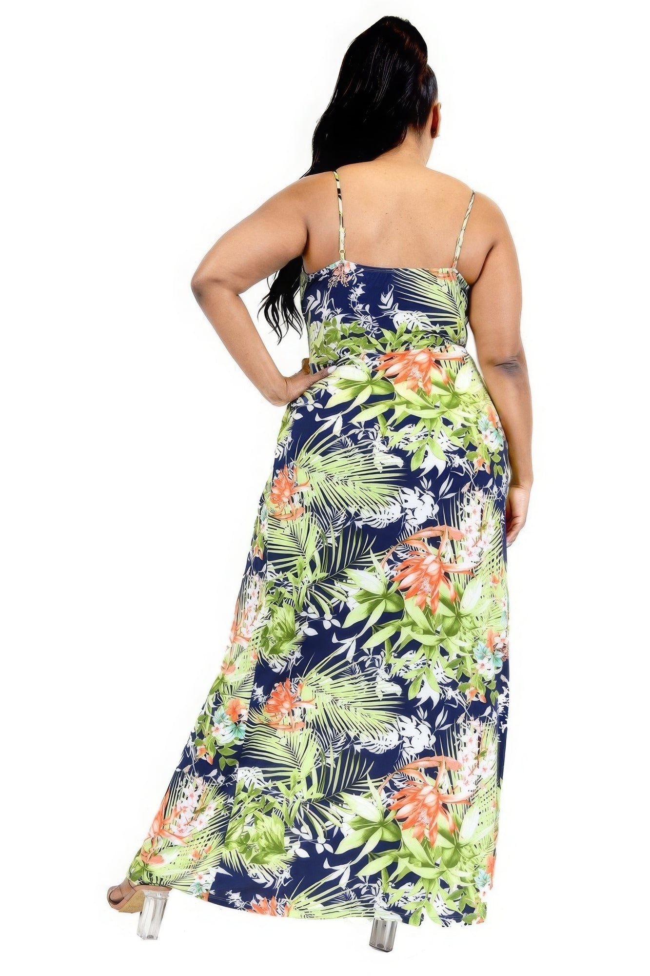 Woman wearing a colorful floral dress on a white background