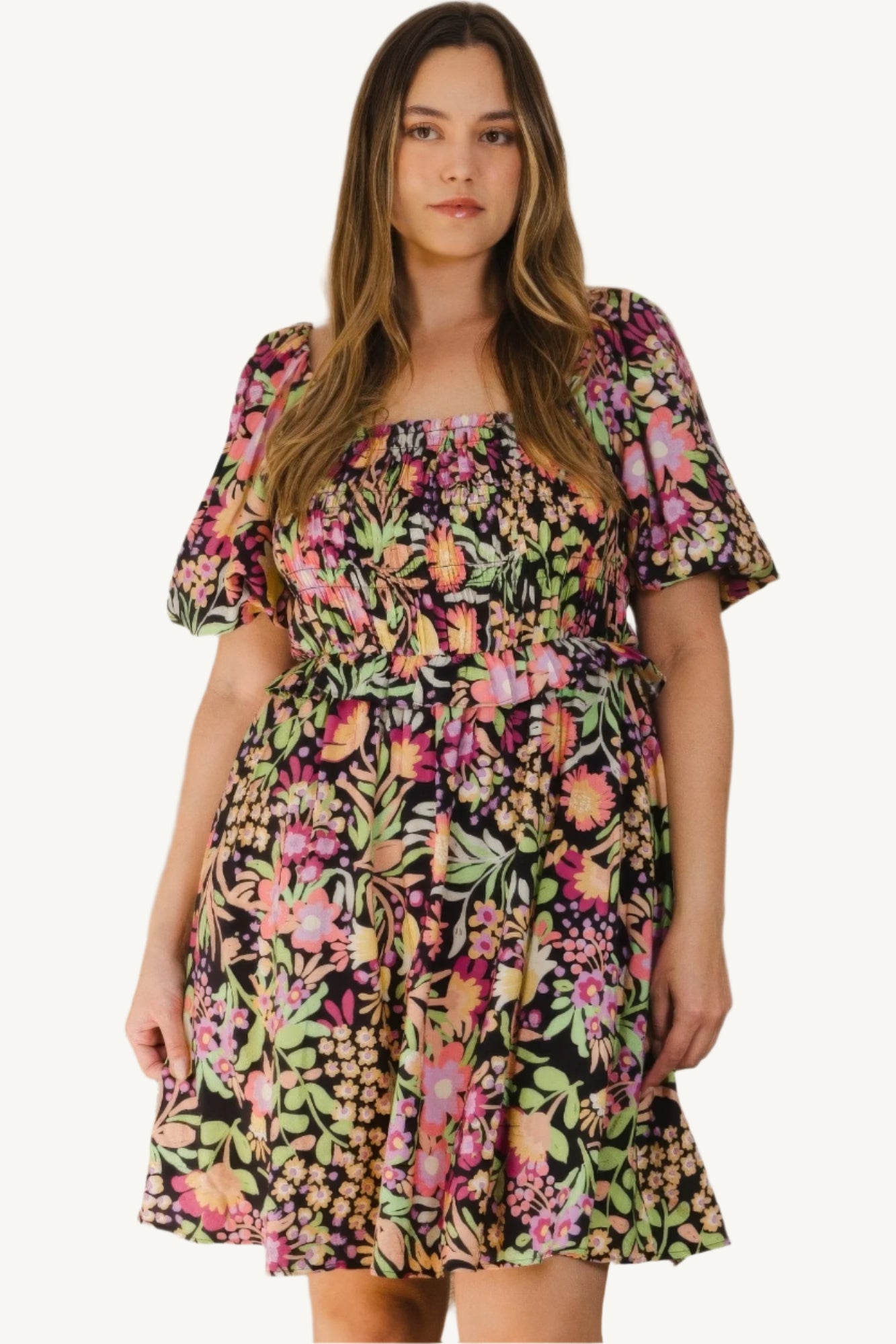 "Plus size floral printed mini dress with center tie-back detail, designed for a flattering, feminine, and comfortable fit."