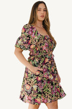 "Plus size floral printed mini dress with center tie-back detail, designed for a flattering, feminine, and comfortable fit."