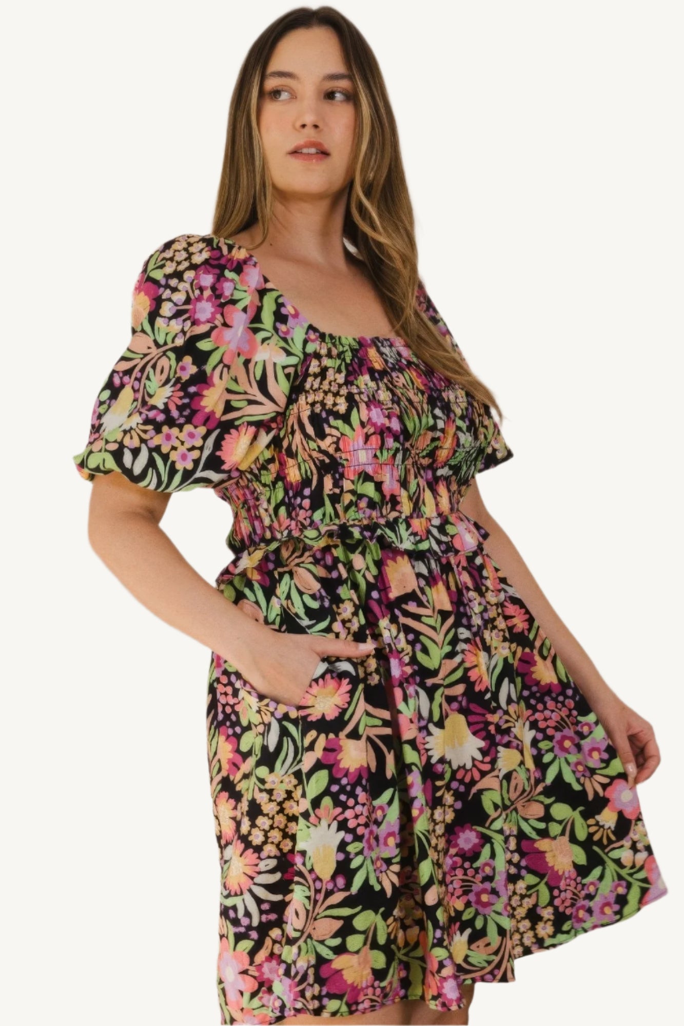 "Plus size floral printed mini dress with center tie-back detail, designed for a flattering, feminine, and comfortable fit."