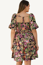 "Plus size floral printed mini dress with center tie-back detail, designed for a flattering, feminine, and comfortable fit."