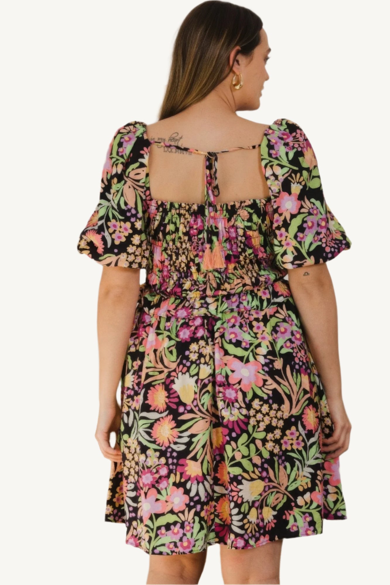"Plus size floral printed mini dress with center tie-back detail, designed for a flattering, feminine, and comfortable fit."