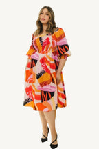 "Plus size floral print midi dress with square neckline, designed for a flattering, elegant, and comfortable fit."