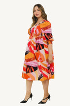 "Plus size floral print midi dress with square neckline, designed for a flattering, elegant, and comfortable fit."