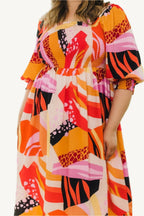 "Plus size floral print midi dress with square neckline, designed for a flattering, elegant, and comfortable fit."
