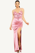 Satin maxi dress with a caged waist detail, crafted for a sleek and elegant silhouette. A graceful and sophisticated ensemble perfect for formal occasions.