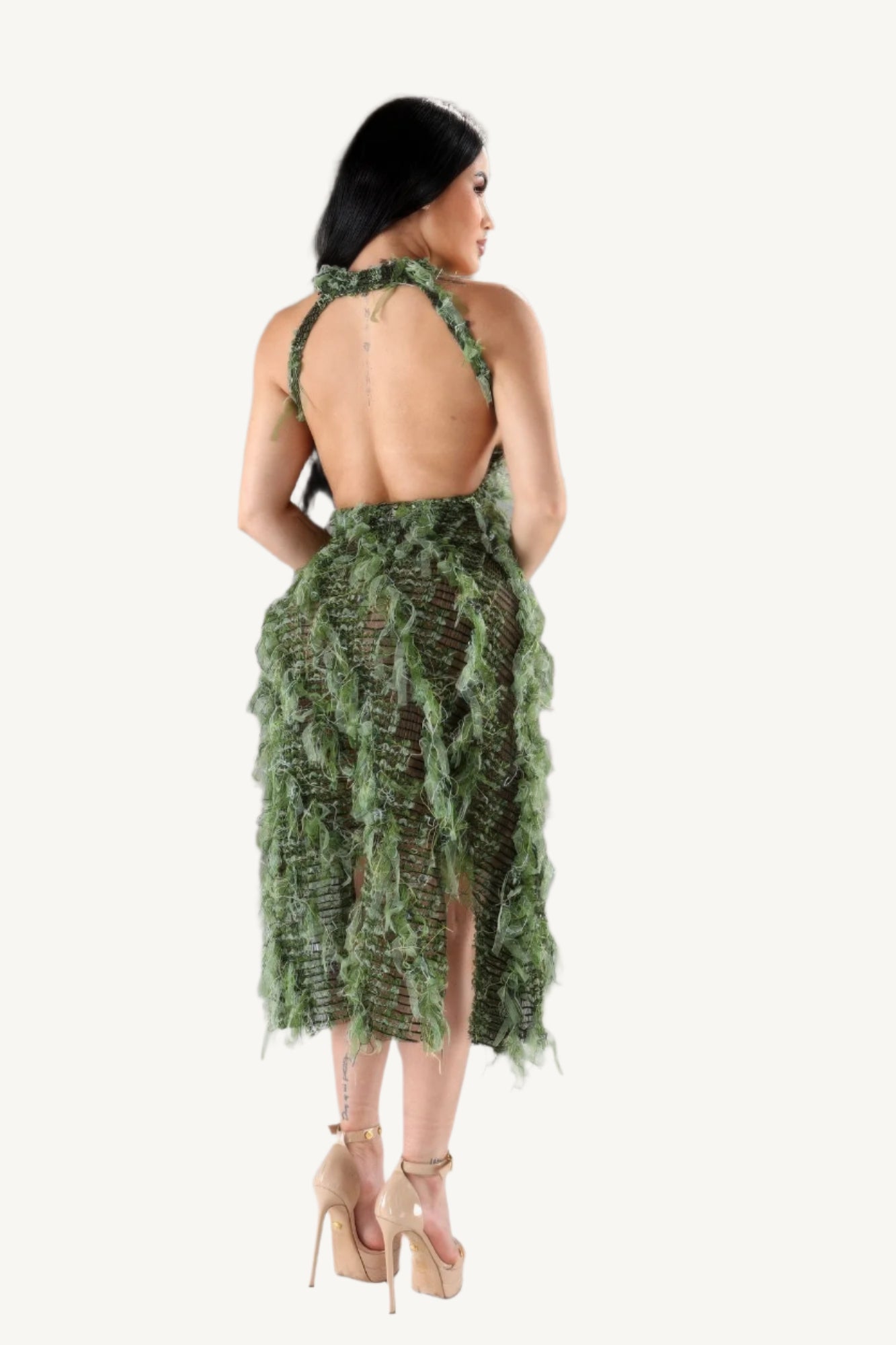Halter ruffled dress with elegant neckline and layered ruffle details. A stylish and comfortable piece designed to blend modern flair with timeless elegance.